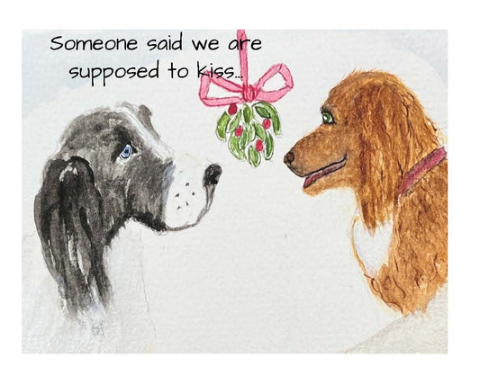 Dogs under mistletoe